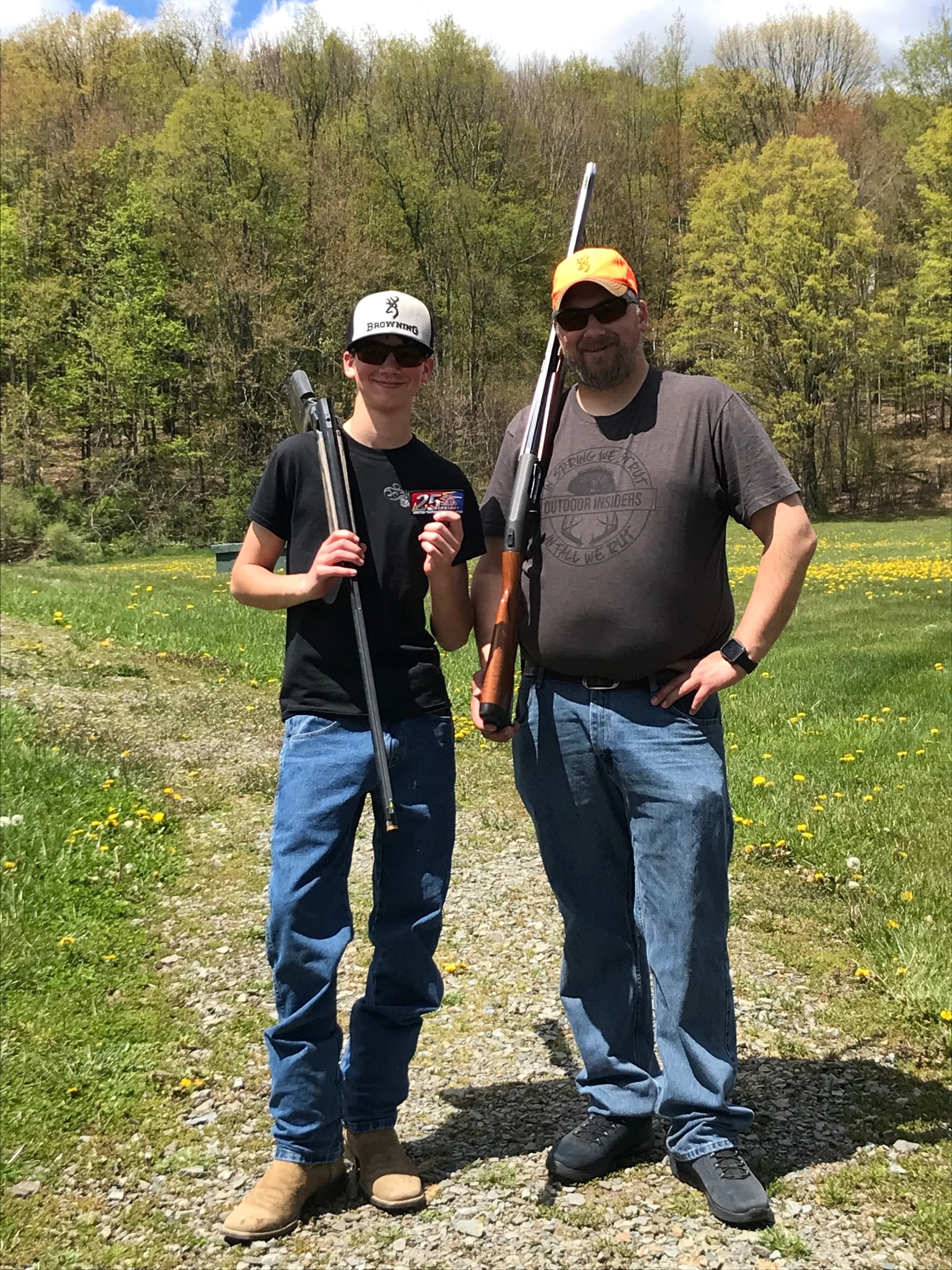 May be an image of 2 people, people skeet shooting and grass